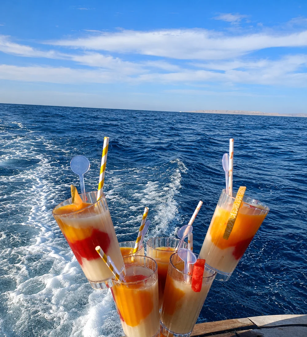 Colourful welcome drinks at the stern of the boat, overlooking the open sea